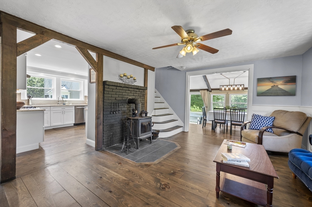 63 River Street Andover, MA 01810 - Photo 27 of 40 a view of a livingroom with furniture wooden floor and a ceiling fan