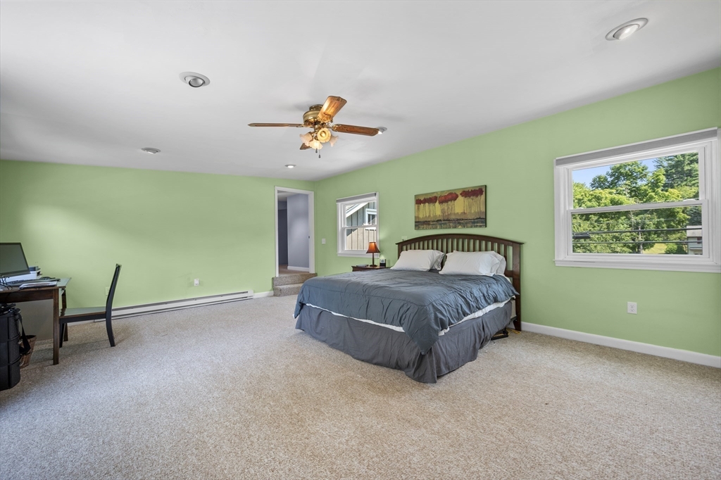 63 River Street Andover, MA 01810 - Photo 33 of 40 a spacious bedroom with a bed and a window