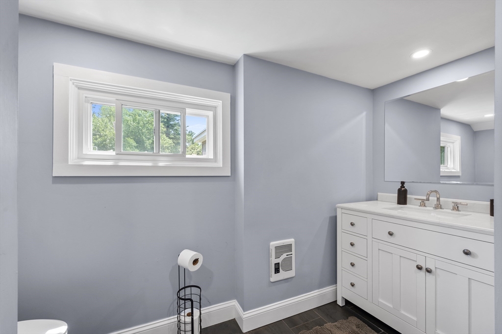 63 River Street Andover, MA 01810 - Photo 35 of 40 a bathroom with a toilet sink and mirror