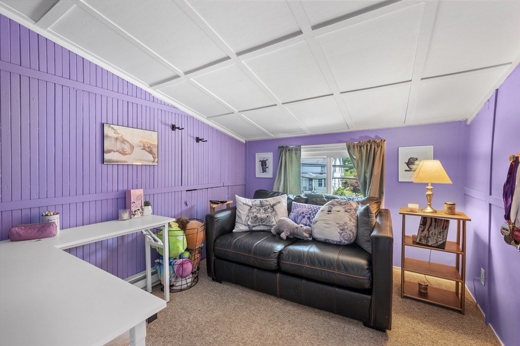 63 River Street Andover, MA 01810 - Photo 38 of 40 a living room with furniture and a window