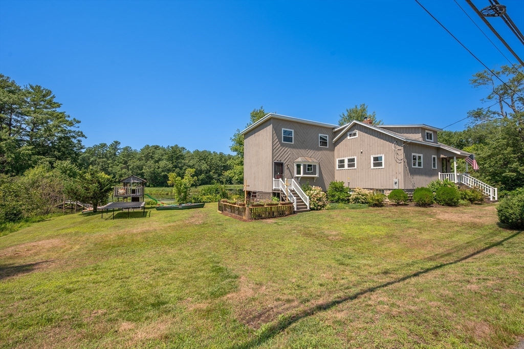 63 River Street Andover, MA 01810 - Photo 39 of 40 a view of a house with swimming pool and porch