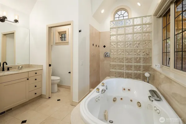 a bathroom with a bathtub and a shower