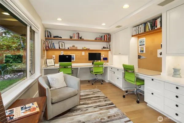 a living room with furniture a fireplace and a window