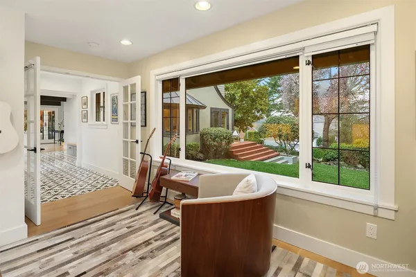 a living room with couch and a large window