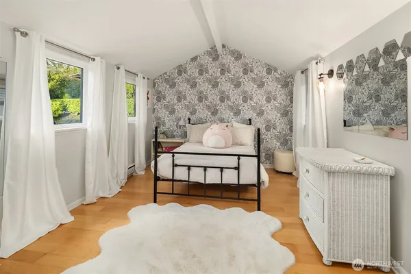 a bedroom with furniture and a bed