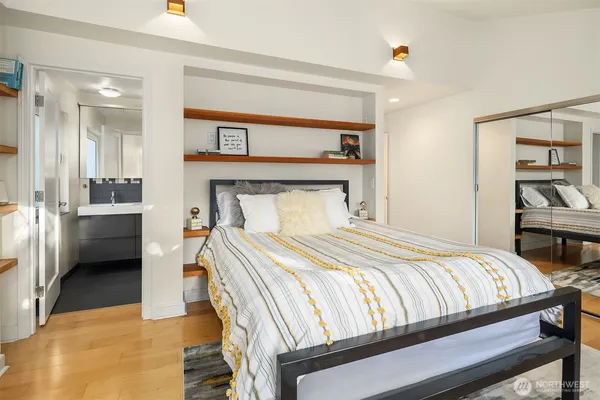 a bedroom with a bed and a view of en suite bathroom