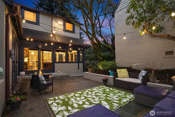 a front view of a house with a yard table and chairs