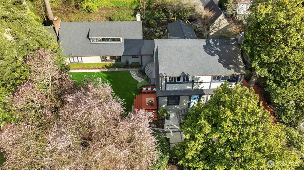 an aerial view of a house with a yard and garden