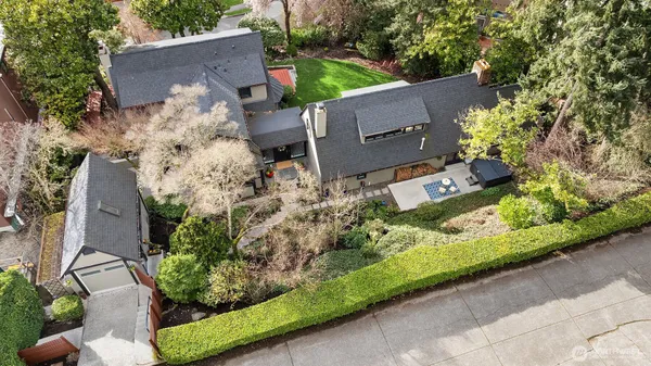 a front view of a house with potted plants