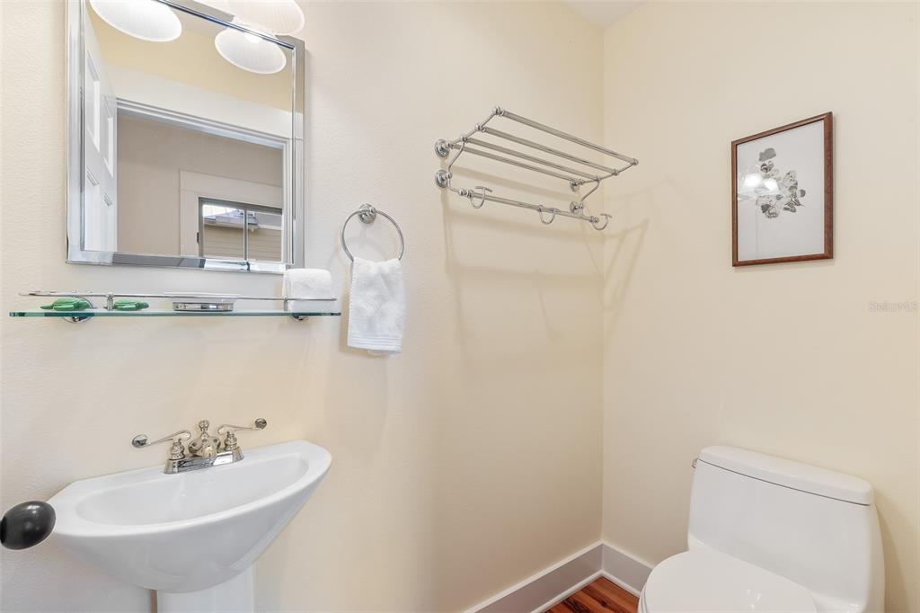 160 1st Street East Boca Grande, FL 33921 - Photo 16 of 43 a bathroom with a sink mirror and toilet