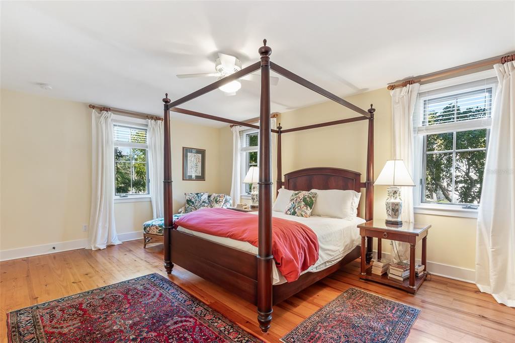160 1st Street East Boca Grande, FL 33921 - Photo 18 of 43 a bedroom with a bed lamp and a window