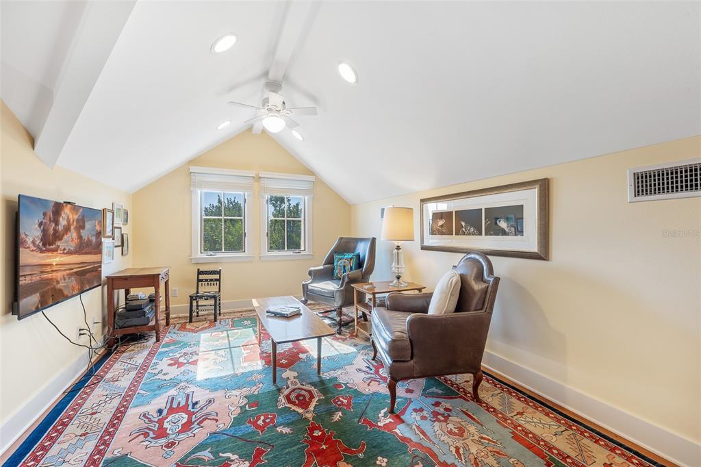 160 1st Street East Boca Grande, FL 33921 - Photo 20 of 43 a living room with furniture two window and a table