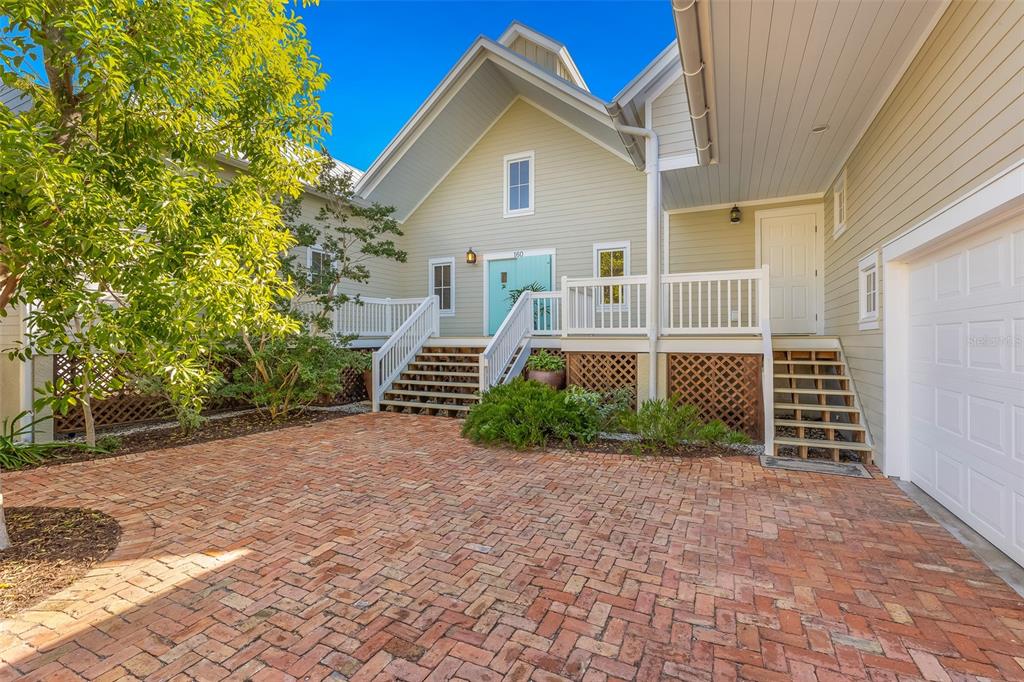160 1st Street East Boca Grande, FL 33921 - Photo 2 of 43 a view of a house with a yard and plants