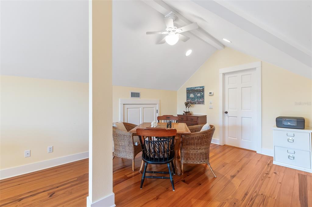 160 1st Street East Boca Grande, FL 33921 - Photo 22 of 43 a view of a dining room with furniture and wooden floor