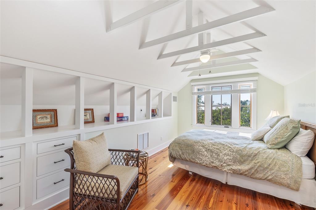 160 1st Street East Boca Grande, FL 33921 - Photo 26 of 43 a bedroom with a bed and a dresser