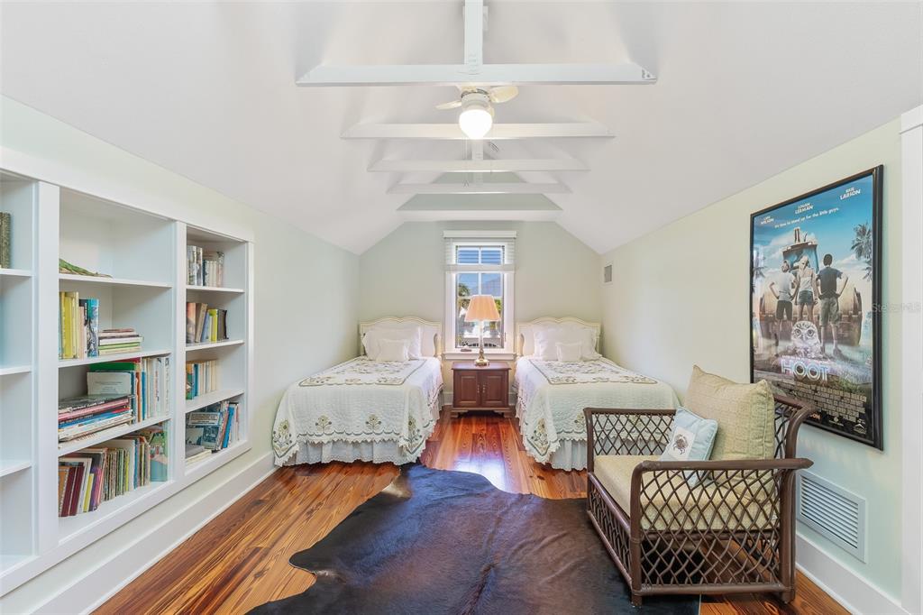 160 1st Street East Boca Grande, FL 33921 - Photo 30 of 43 a living room with furniture and a book shelf