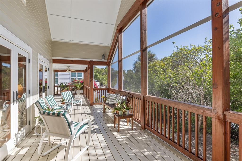 160 1st Street East Boca Grande, FL 33921 - Photo 31 of 43 a view of an chairs and tables in the balcony