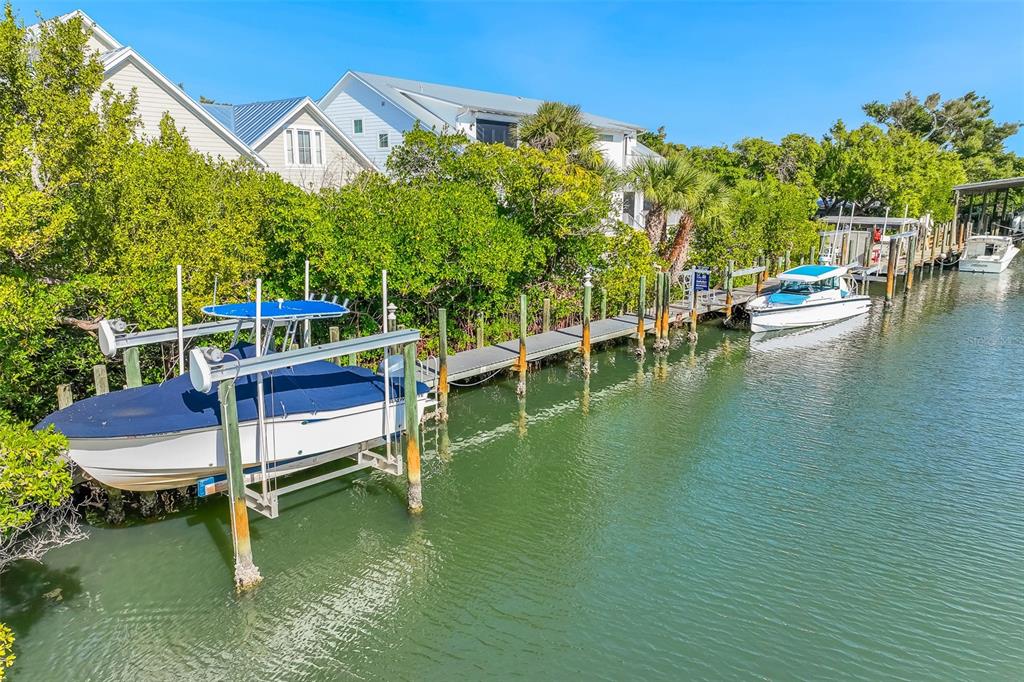 160 1st Street East Boca Grande, FL 33921 - Photo 37 of 43 a view of swimming pool with outdoor seating and yard