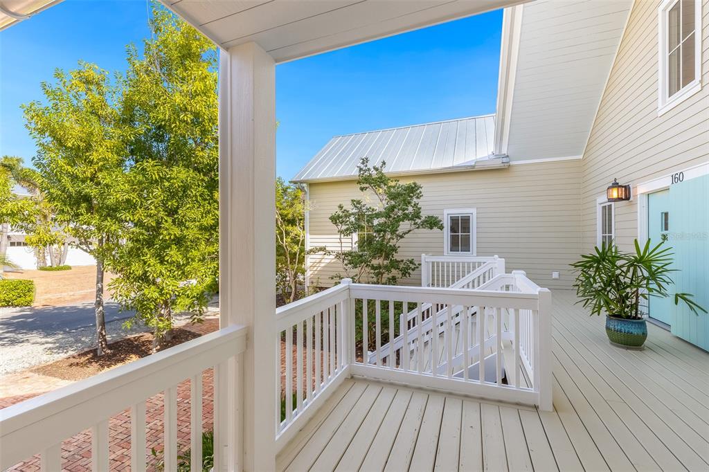160 1st Street East Boca Grande, FL 33921 - Photo 4 of 43 a view of a balcony with wooden floor