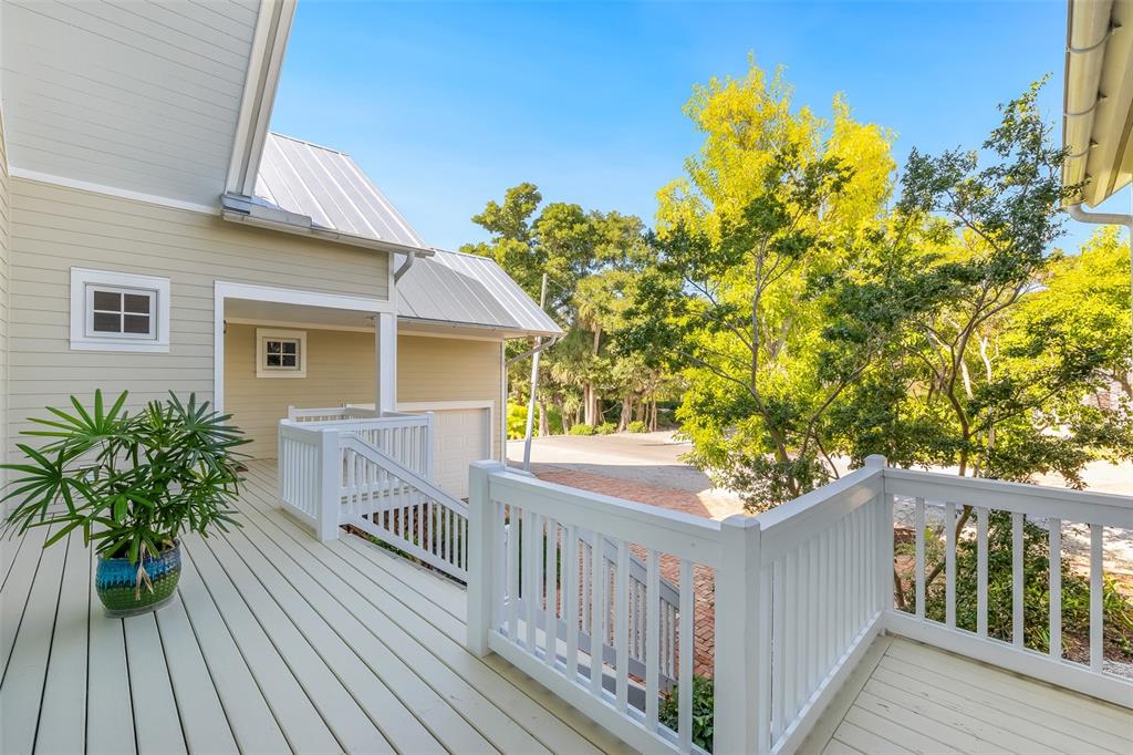 160 1st Street East Boca Grande, FL 33921 - Photo 5 of 43 a view of a house with balcony and wooden floor
