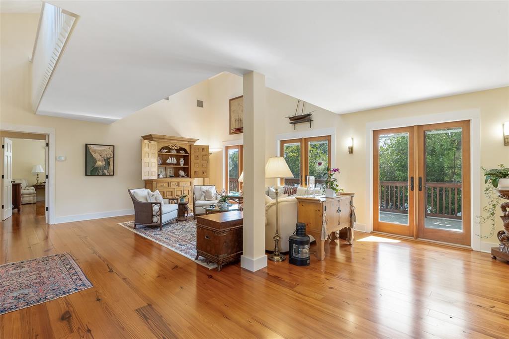 160 1st Street East Boca Grande, FL 33921 - Photo 8 of 43 a living room with fireplace furniture and floor to ceiling windows