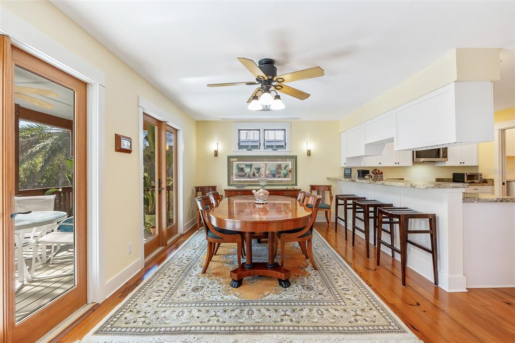 160 1st Street East Boca Grande, FL 33921 - Photo 9 of 43 a living room with stainless steel appliances furniture a rug and a view of kitchen