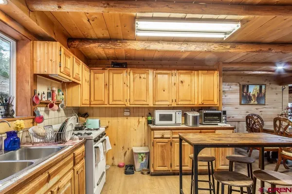 a kitchen with stainless steel appliances granite countertop a sink and cabinets
