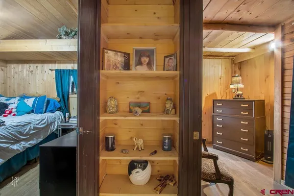 a bed room with a bed and a mirror