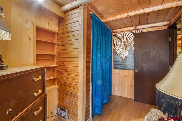 a bed room with a bed and a dresser