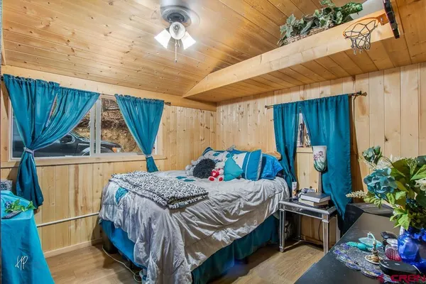 a bed room with a bed and a window