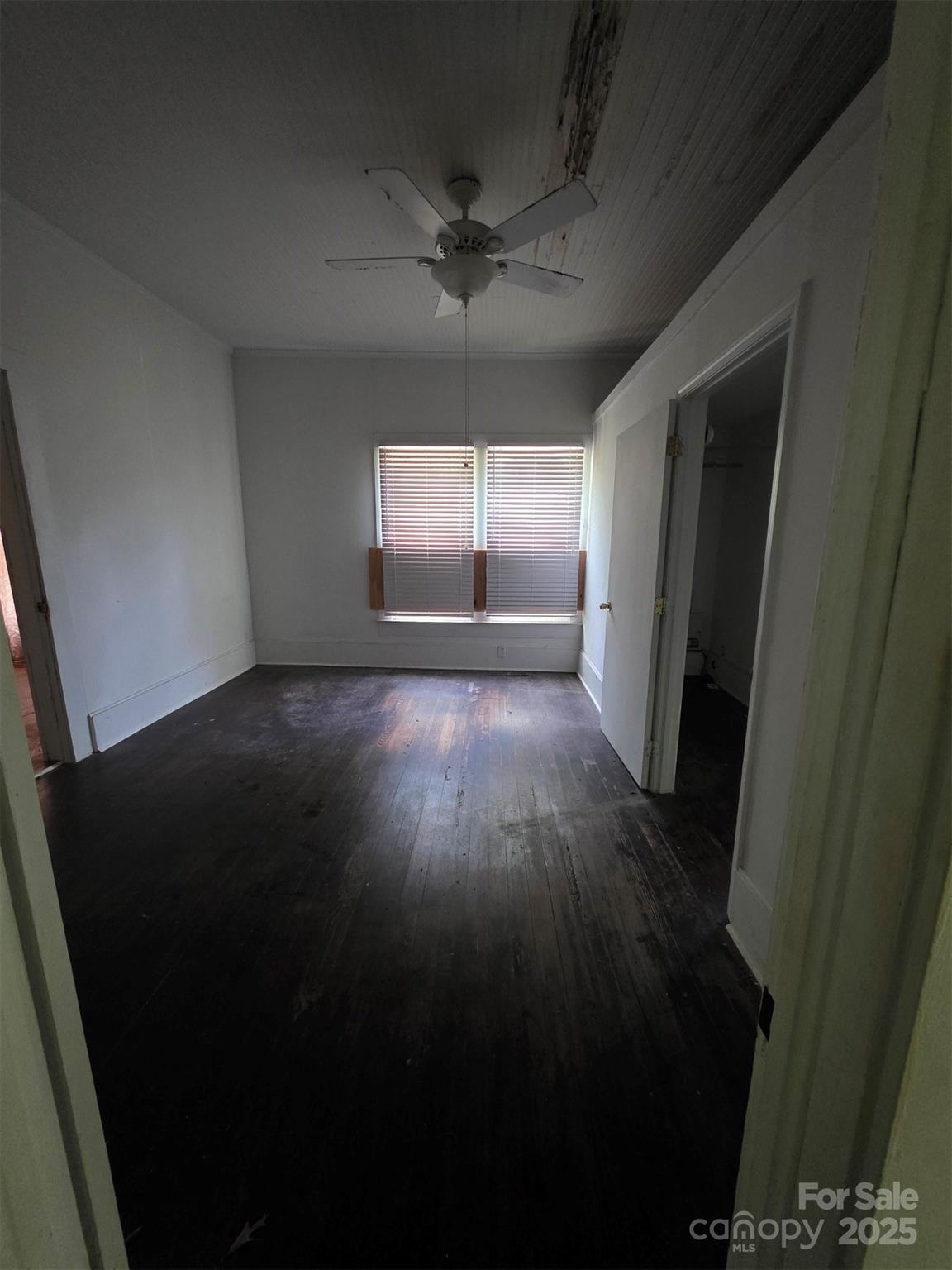 330 Plank Road Wadesboro, NC 28170 - Photo 20 of 23 an empty room with wooden floor and windows