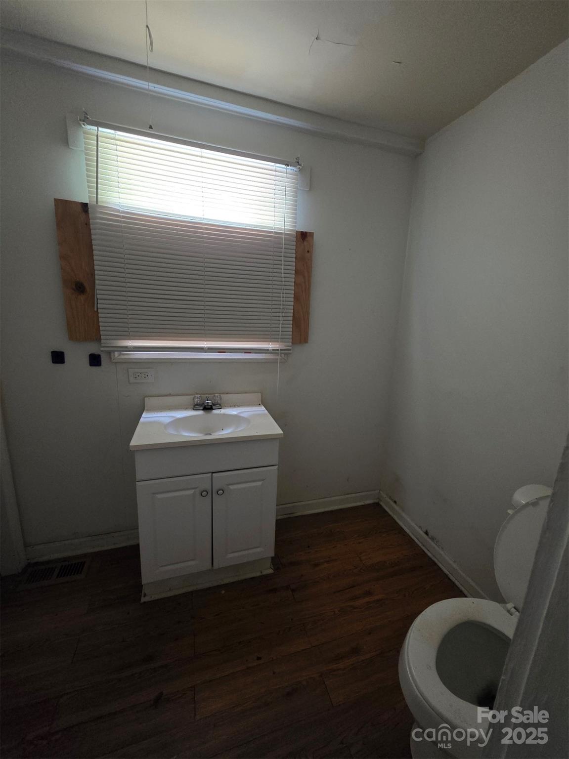 330 Plank Road Wadesboro, NC 28170 - Photo 23 of 23 a bathroom with a toilet sink and mirror