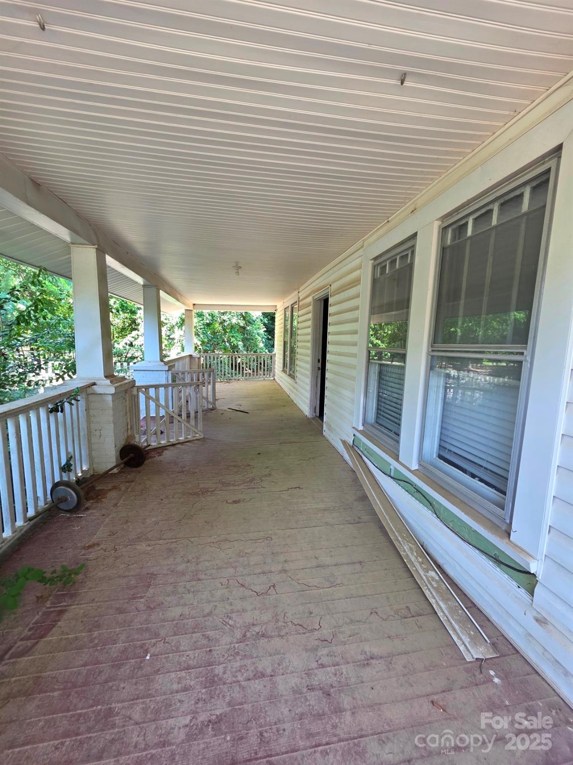 330 Plank Road Wadesboro, NC 28170 - Photo 9 of 23 a view of a porch with furniture and large windows