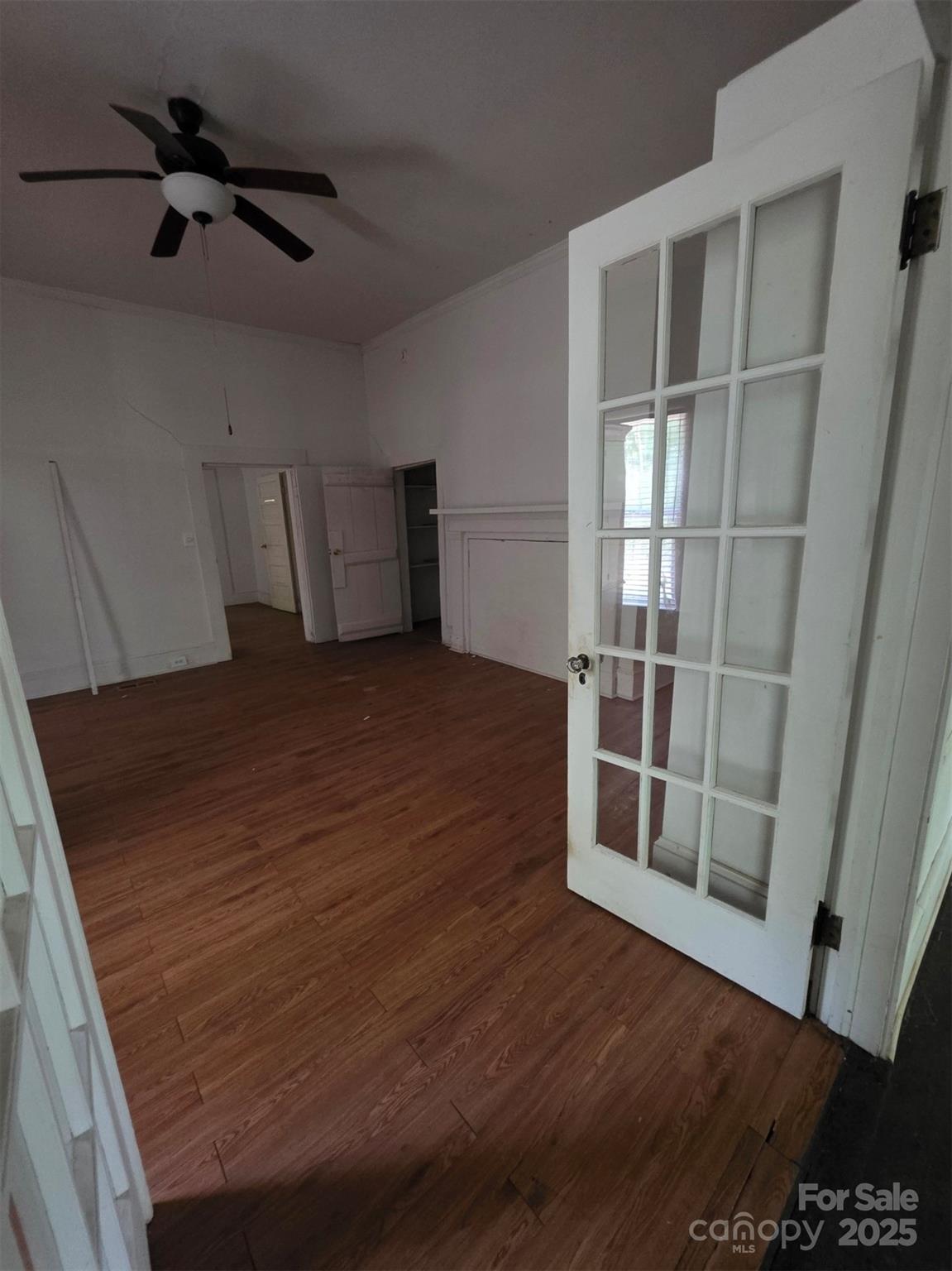 330 Plank Road Wadesboro, NC 28170 - Photo 10 of 23 a view of an empty room with wooden floor and a window