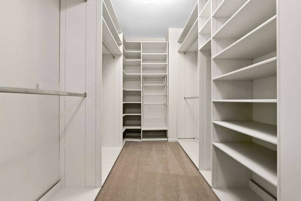 40 Village Road, Unit 1601 Middleton, MA 01949 - Photo 29 of 38 a view of walk in closet with empty racks