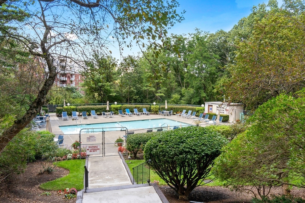 40 Village Road, Unit 1601 Middleton, MA 01949 - Photo 32 of 38 a view of a swimming pool with a patio