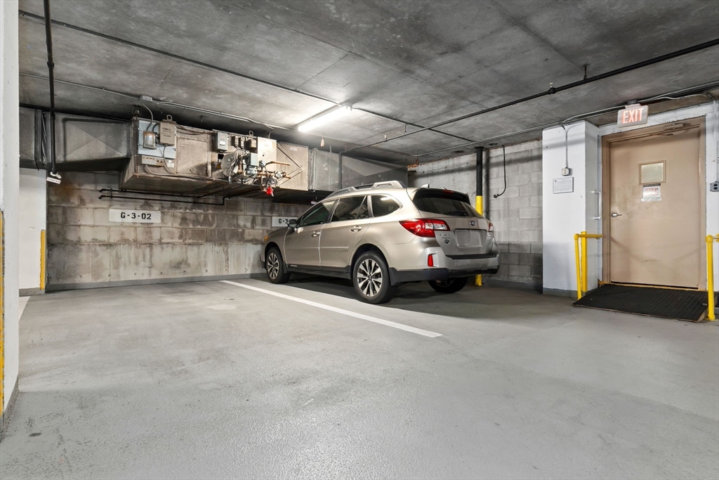 40 Village Road, Unit 1601 Middleton, MA 01949 - Photo 35 of 38 a view of parking garage with cars