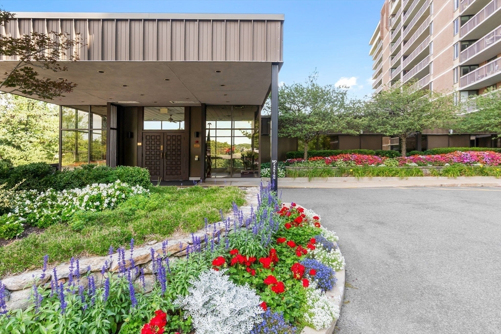 40 Village Road, Unit 1601 Middleton, MA 01949 - Photo 4 of 38 a front view of a house with a yard and fountain