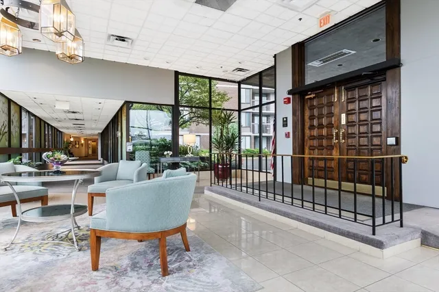 a sign board in front of a brick building