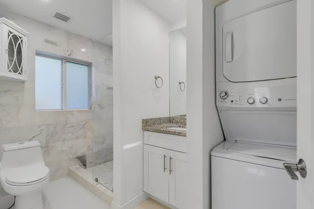 a bathroom with a toilet sink and tub