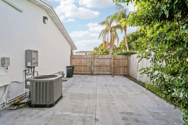 a view of a patio with table and chairs