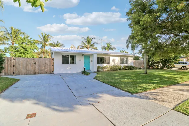 front view of a house with a yard