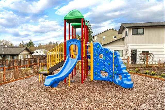 a view of a park with iron fence
