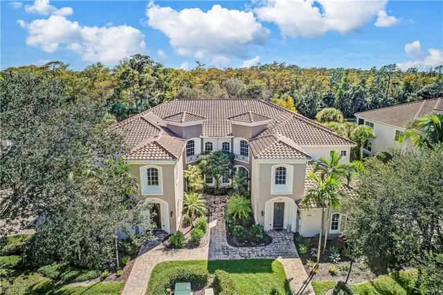 a aerial view of a house with a yard