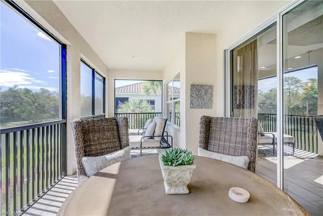 a balcony with furniture and garden