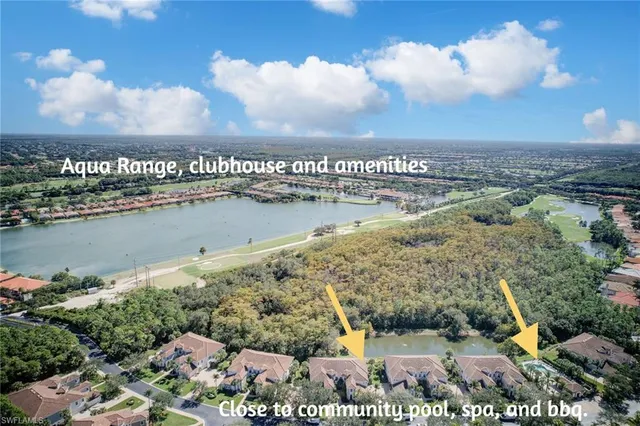 an aerial view of a house with a lake view