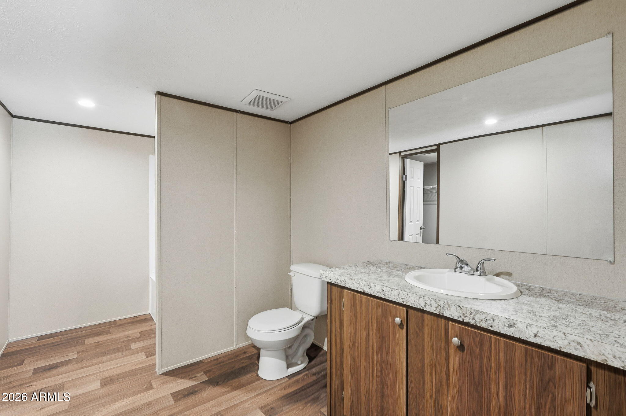 10567 North Dogwood Road Florence, AZ 85132 - Photo 15 of 28 a bathroom with a granite countertop sink toilet and shower