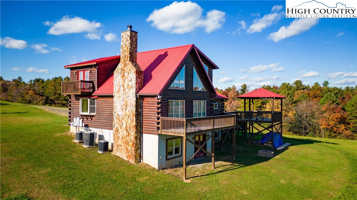 498 Saddle View Road Ennice, NC 28623 - Photo 8 of 50 a house view with a outdoor seating space