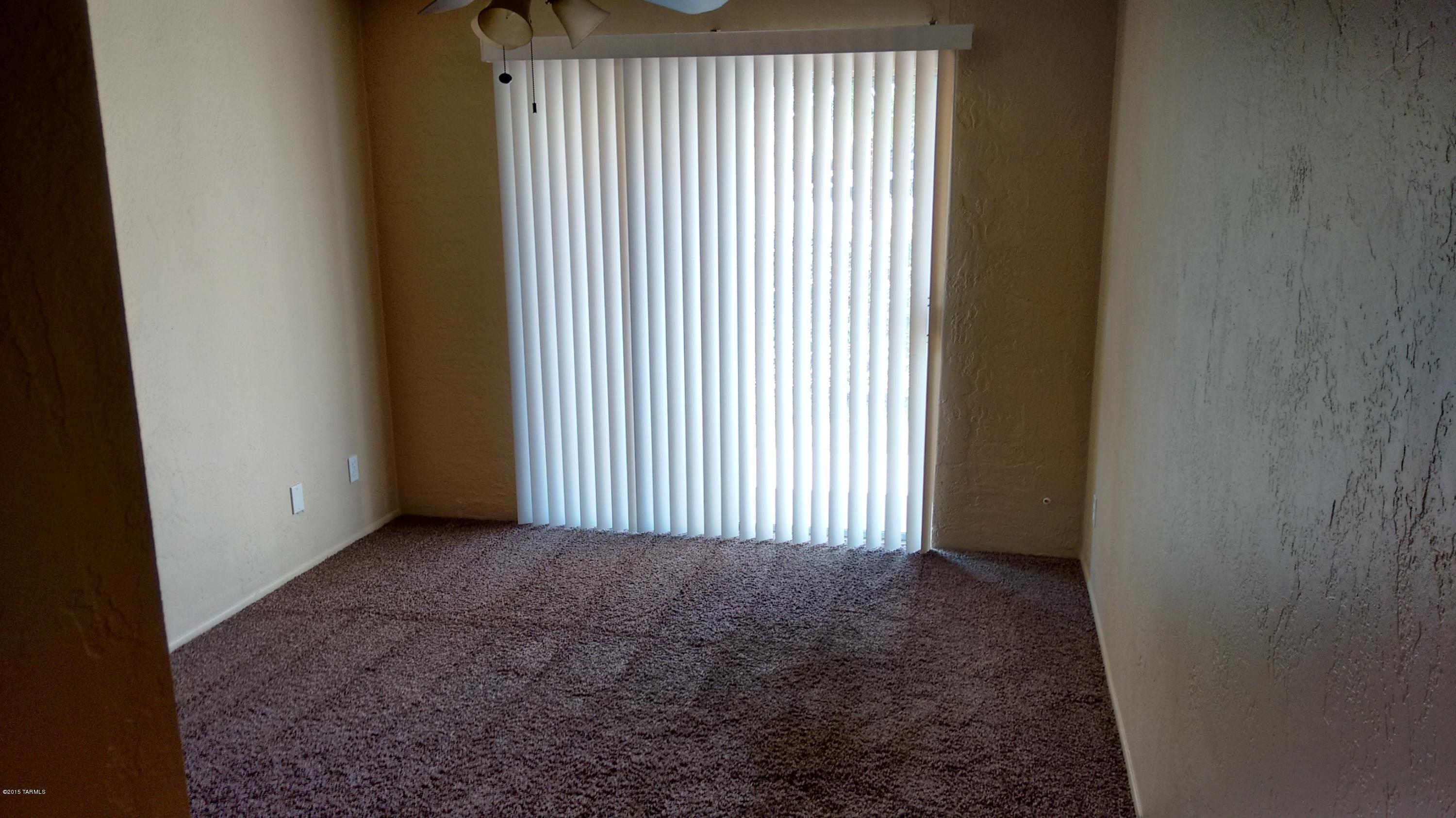 625 South Prudence Road, Unit 102 Tucson, AZ 85710 - Photo 15 of 25 a view of a room with a window in a room