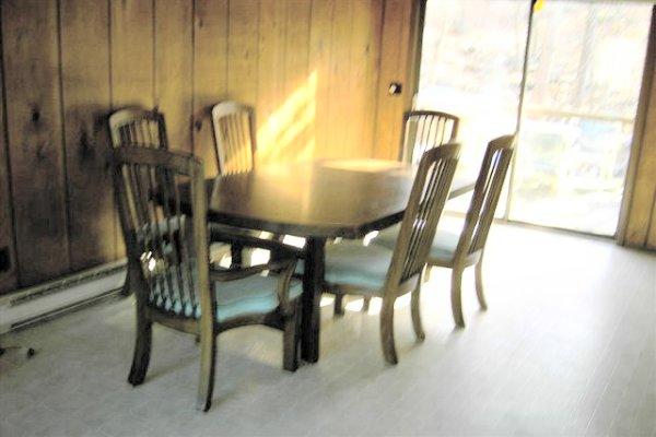 795-13 Decker Road Bushkill, PA 18324 - Photo 5 of 7 a view of a dining room with furniture and chandelier